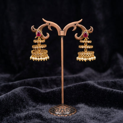 Timeless Ruby Jhumkas - Studio shot featuring luxury jewelry design.